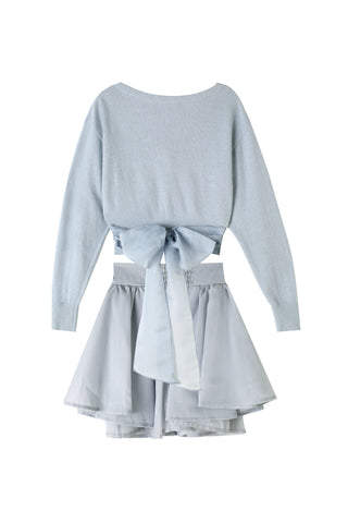 Light blue long-sleeve top and skirt set on a white background