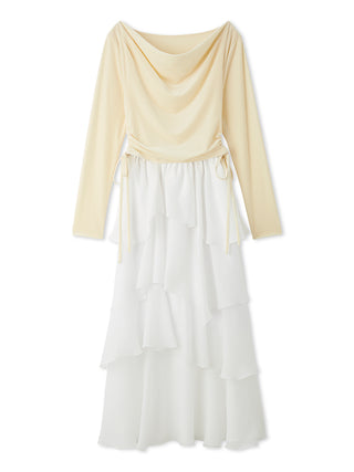 A long-sleeve maxi dress with a draped cowl neckline and a tied waist, featuring a pale yellow top half and a white ruffled tiered skirt on a white background.