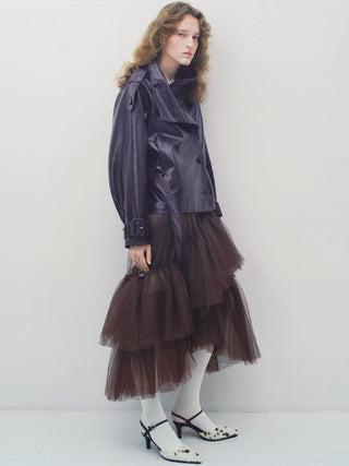 Model styling the brown SNIDEL Stand Collar Belted Jacket with a tiered skirt and slingback heels.
