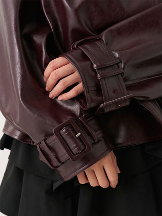 Close-up of the adjustable buckle cuffs on the brown SNIDEL Stand Collar Belted Jacket.