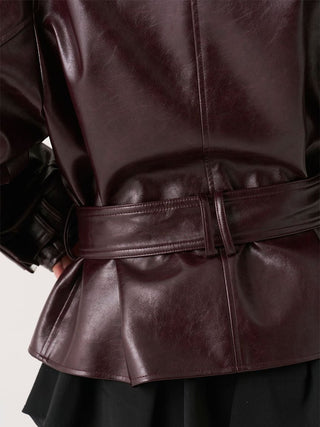 Back waist detail of the brown SNIDEL Stand Collar Belted Jacket showing belt loop and center seam.