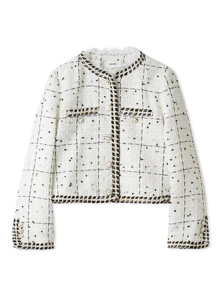 A cropped tweed jacket in off-white with a black windowpane check pattern and black rope trim, featuring buttoned flap pockets and a button-front closure, shown on a plain white background.