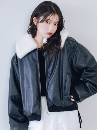 Model wearing the black SNIDEL Faux Fur Blouson open, showing its white fur collar and side pocket.