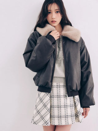 Model wearing the brown SNIDEL Faux Fur Blouson with a beige fur collar and a white checked mini skirt.