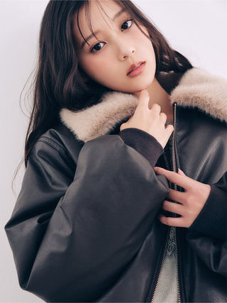 Close-up of the brown SNIDEL Faux Fur Blouson, showing its beige fur collar, ribbed cuff and front zipper.