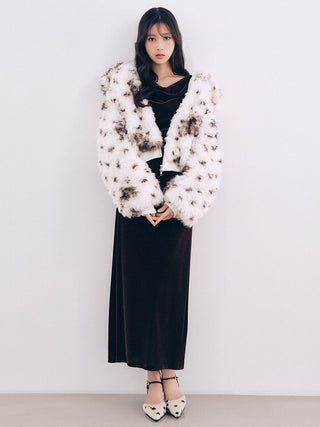 White and brown patterned SNIDEL Faux Fur Blouson styled with a black midi dress and patterned heels.