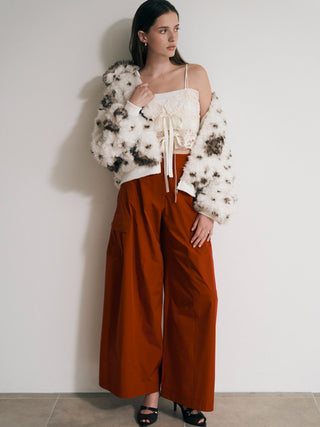 SNIDEL Faux Fur Blouson in a white and brown pattern, styled with a white lace top and orange wide-leg pants.