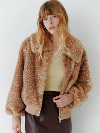 Model wearing the SNIDEL Faux Fur Blouson in a brown spotted pattern, open over a pale knit top.