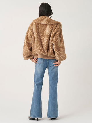 Full-length back view of the brown spotted SNIDEL Faux Fur Blouson styled with flared blue jeans.