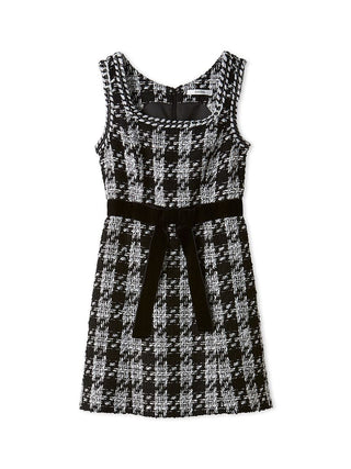 A sleeveless black and white tweed dress with a square neckline, a matching black fabric tie belt at the waist, and a subtle houndstooth pattern.