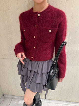 Gray SNIDEL Twist Frill Mini Skort styled with a burgundy cardigan, black handbag and tall boots.