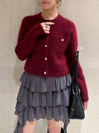 Front view of the gray SNIDEL Twist Frill Mini Skort worn with a burgundy cardigan, showing three ruffled tiers.