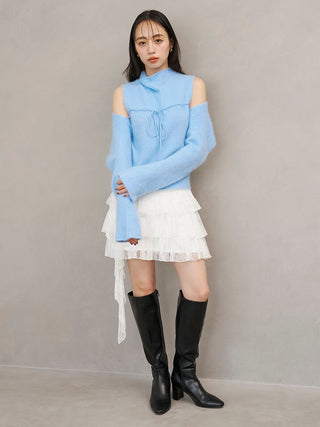 White SNIDEL Twist Frill Mini Skort styled with a blue cold-shoulder knit top and black knee-high boots.