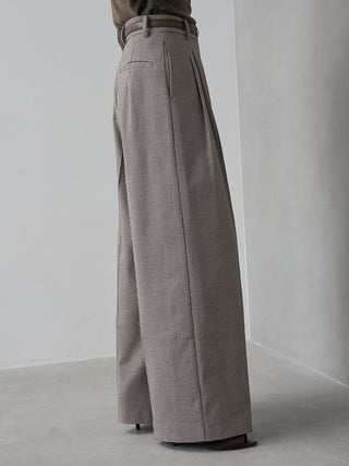 Side view of the checked SNIDEL Belted Tuck Pants, showing the side pocket and wide-leg silhouette.