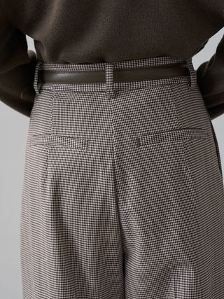 Close-up of the checked SNIDEL Belted Tuck Pants' back waistband, belt loops and two welt pockets.