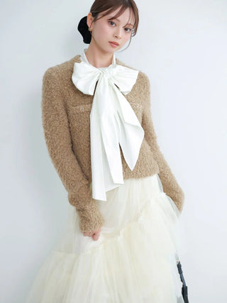 Cream SNIDEL Asymmetrical Tulle Volume Skirt styled with a beige knit top and an oversized white bow.
