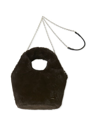 A dark brown faux fur shoulder bag with a circular cutout handle and a silver chain strap with a black leather loop, shown on a plain white background.