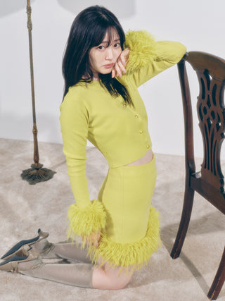 Lady in Yellow Fur Hem Knit Skirt kneeling