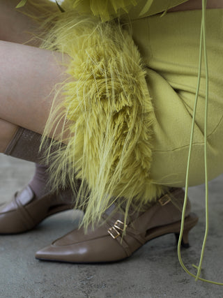 Lady in Yellow Fur Hem Knit Skirt sitting