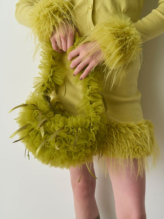 Woman in Yellow Fur Hem Knit Skirt