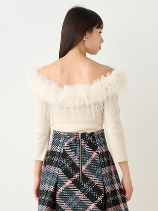 Woman in White Decollete Faux Fur Knit Pullover Back View