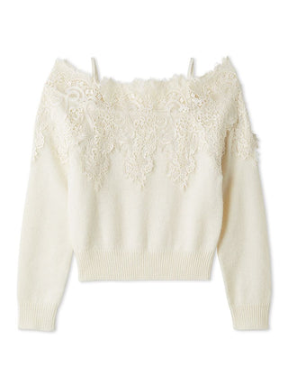 An off-the-shoulder cream knit sweater featuring intricate floral lace applique across the chest and upper sleeves, with ribbed cuffs and hem.