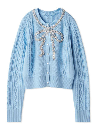 A light blue cable-knit cardigan sweater featuring a decorative bow embellishment on the chest made of pearls and crystals, set against a plain white background.