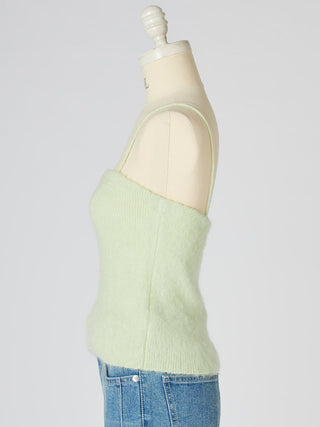 A pale mint green fuzzy knit camisole top displayed on a cream dress form mannequin, paired with blue jeans against a light gray background.