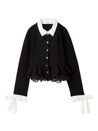 A black long-sleeve blouse with a contrasting white pointed collar, white button placket, ruffled hem, and white ribbon ties at the cuffs, shown on a plain white background.