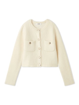 A cream-colored cropped cardigan jacket with long sleeves, two front flap pockets, and decorative gold-tone buttons, shown on a plain white background.