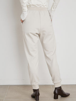 Simple Women's Sweatpants in ivory, Knit Flared Pants Premium Fashionable Women's Pants at SNIDEL USA